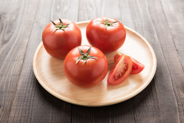 Tomatoes on the old wooden table