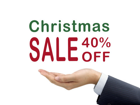 Christmas sale 40 percent off holding by businessman's hand