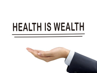 health is wealth words holding by businessman's hand