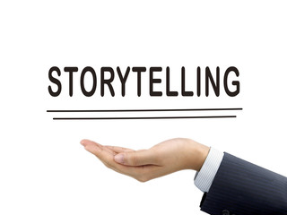 storytelling word holding by businessman's hand