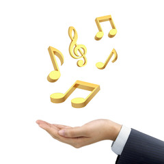 businessman's hand holding music notes