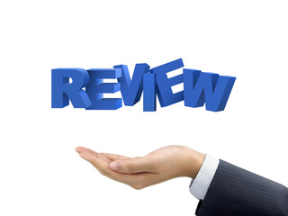 businessman's hand holding review words