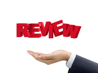 businessman's hand holding review words