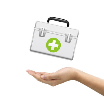 businessman's hand holding first aid kit