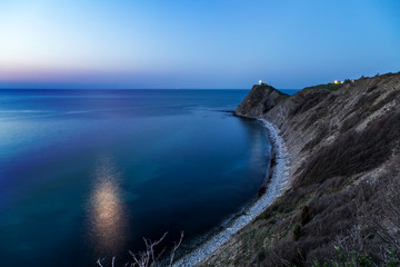 Sea cape and moonlight