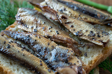 Smoked fish on bread in rustic style