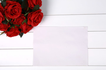 Roses flowers on Valentine's or mother's day on wooden board with copyspace for your own text