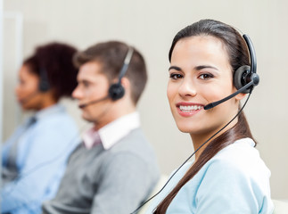 Smiling Female Customer Service Representative In Office