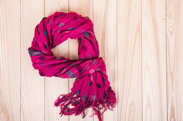 red scarf on wooden background
