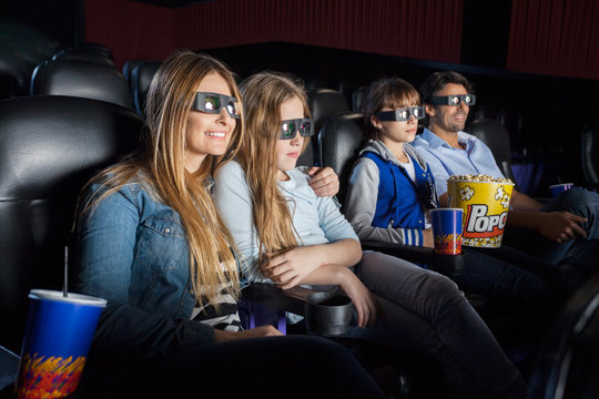 Family Watching 3D Movie In Theater