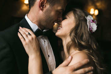 The bride and groom in a cozy house, photo taken with natural li