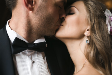 The bride and groom in a cozy house, photo taken with natural li