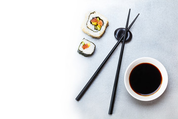 two roll, soy sauce and chopsticks