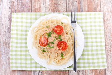 spaghetti bolognese on a white plate, top view