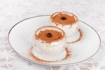 dessert with whipped cream decorated cocoa in glass beaker