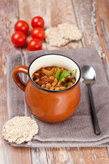 tomato soup with lentil, celery and sweet pepper garnished with