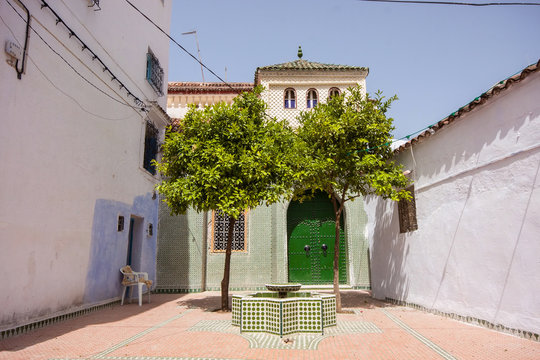 white house with green winches, Chefchaouen, Morocco