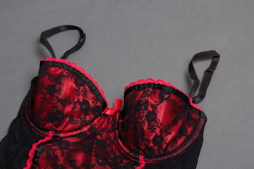 red sexy female lingerie on grey