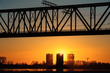 Obraz premium Railroad bridge and construction site on river bank 
