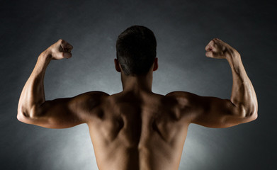 young man showing biceps