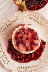 coconut panna cotta dessert with pomegranate