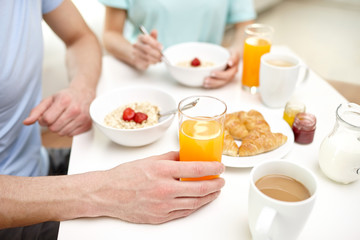 Fototapeta na wymiar close up of couple having breakfast at home