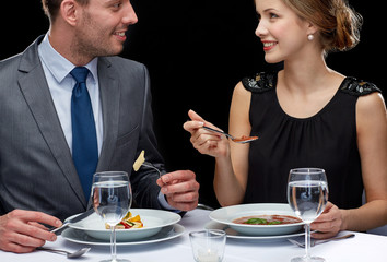 close up of couple talking at restaurant