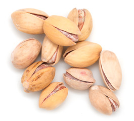 Salted pistachios on white background