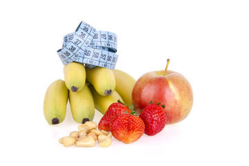 Delicious fresh fruits and cashew nuts on white background