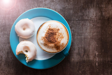 Coffee and cake on a wooden table background