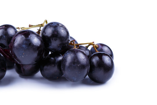 Tasty grapes on a white background.