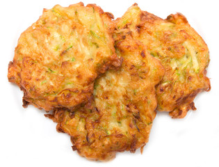 zucchini fritters on a white background