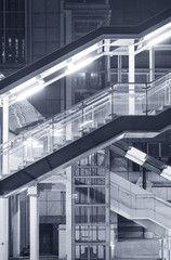 Futuristic stairway and pedestrian walkway in modern building