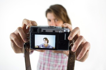 Casual brunette taking a selfie