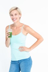 Beautiful woman holding green juice