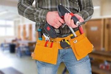 manual worker holding gloves and hammer power drill