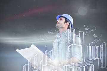 Composite image of architect with blueprint