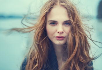 portrait of a beautiful girl on a cold windy day - 81561937