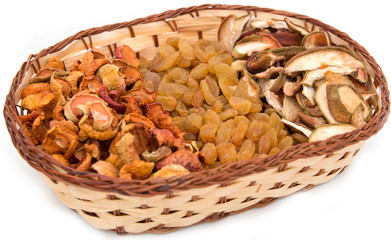 a mixture of dried fruits in a basket