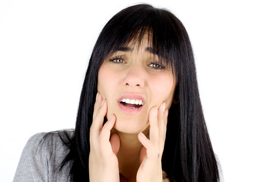 Sad woman suffering pain because of dead teeth