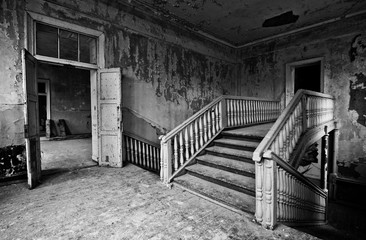 Black and white staircase in the abandoned mansion