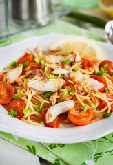 Fresh delicious pasta with fish and tomato sauce