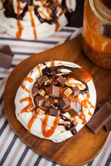 Caramel and chocolate Pavlova meringue cake