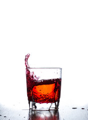 water splash in glass isolated on white