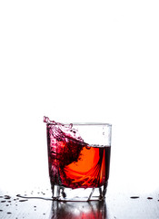 water splash in glass isolated on white