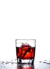 water splash in glass isolated on white
