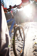 Hands holding handlebar of a bicycle