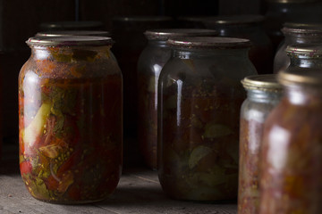 Vegetables preserves on wooden background