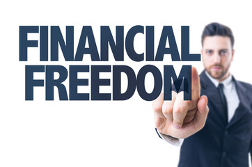 Business man pointing the text: Financial Freedom