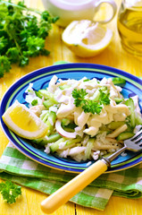 Salad from rice,calamari and fresh cucumber.